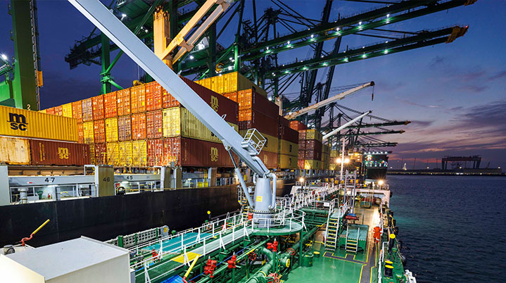 vessel at sunset bunkering fuel